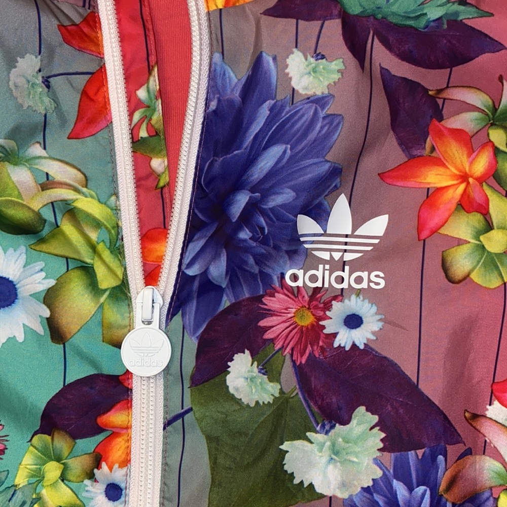 Adidas
Adidas Pink Floral Track Jacket/Fits Ladies Med./cool batwing sleeves